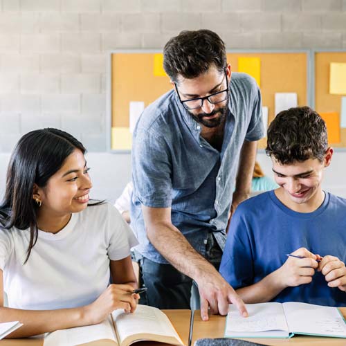 Teacher guiding students during Empower Schools training session.
