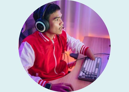 Male gamer intensely playing online games, illustrating gaming addiction for a behavioral health disorders