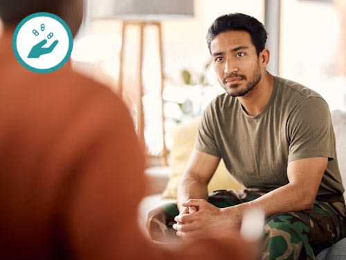 Woman sitting and talking to a meantal health coach