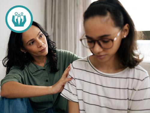 Teenager sitting with Psychologist